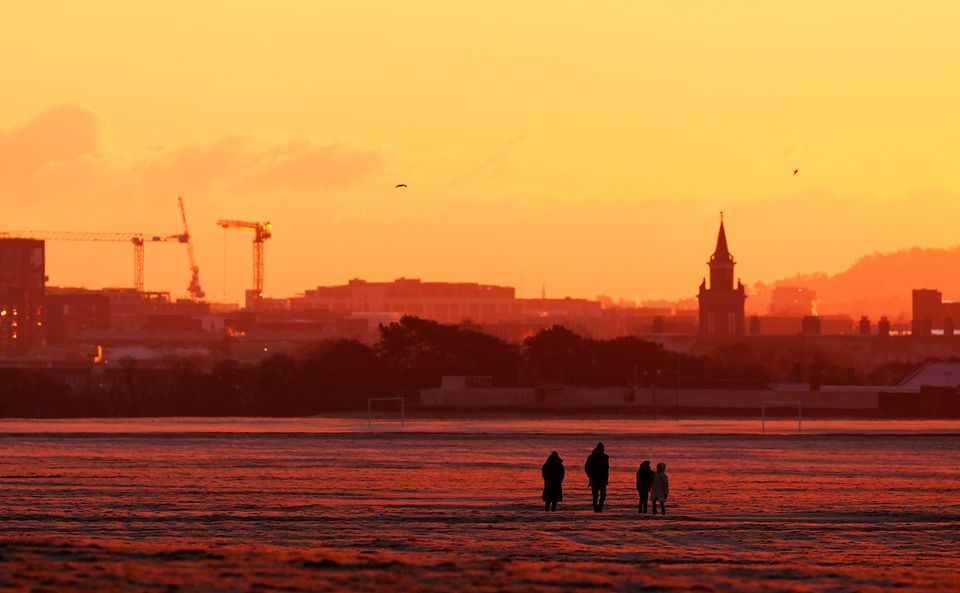 People walk through Phoenix Park in Dublin during icy weather. Photo: PA